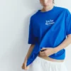 Μπλε T-shirt με γραφικό και σλόγκαν Μπλε T-shirt με γραφικό και σλόγκαν