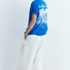 Μπλε T-shirt με γραφικό και σλόγκαν Μπλε T-shirt με γραφικό και σλόγκαν