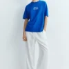 Μπλε T-shirt με γραφικό και σλόγκαν Μπλε T-shirt με γραφικό και σλόγκαν