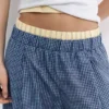 Παντελόνι σε στυλ πιτζάμας με καρό μοτίβο και πιέτες Παντελόνι σε στυλ πιτζάμας με καρό μοτίβο και πιέτες