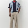 Πλεκτό Polo shirt με κεντημένες ρίγες
