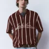 Ριγέ πλεκτό Polo shirt με φερμουάρ