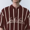 Ριγέ πλεκτό Polo shirt με φερμουάρ