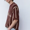 Ριγέ πλεκτό Polo shirt με φερμουάρ