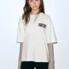 T-shirt με διπλά μανίκια και σλόγκαν T-shirt με διπλά μανίκια και σλόγκαν