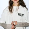T-shirt με διπλά μανίκια και σλόγκαν T-shirt με διπλά μανίκια και σλόγκαν