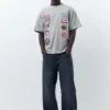T-shirt με κοντό μανίκι και μπαλώματα T-shirt με κοντό μανίκι και μπαλώματα